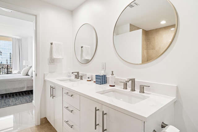 bathroom with vanity and tile patterned floors