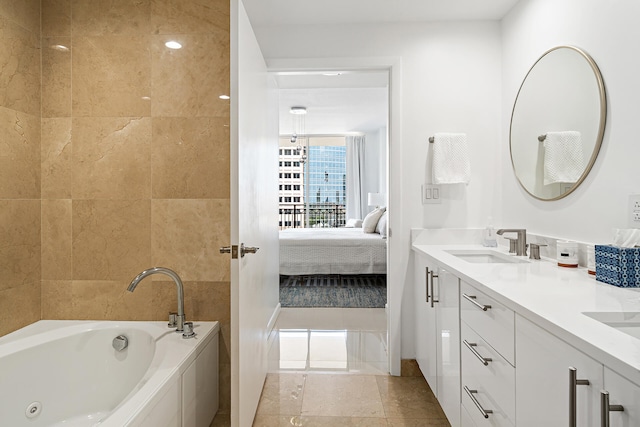 bathroom with vanity, a bathtub, and tile patterned flooring