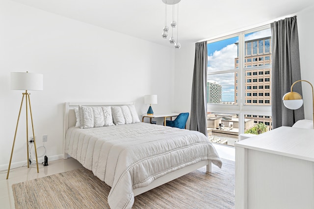 bedroom featuring light tile patterned floors