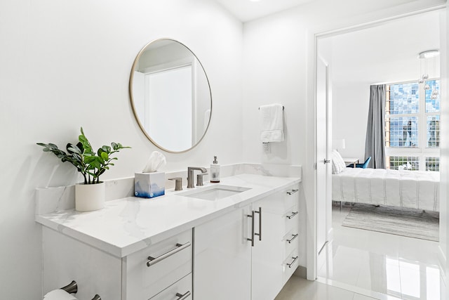 bathroom with tile patterned floors and vanity