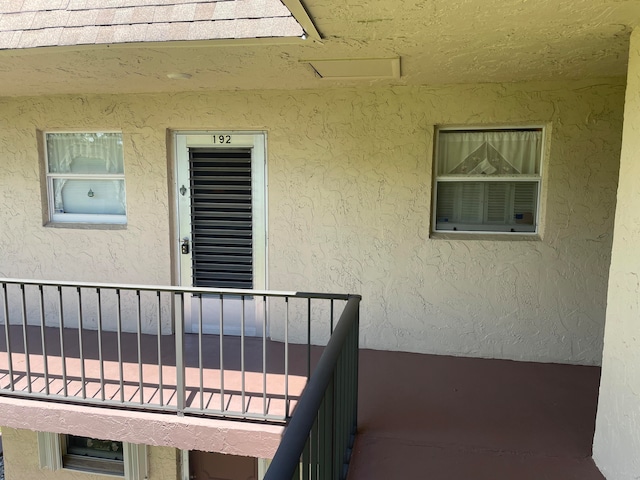 entrance to property with a balcony