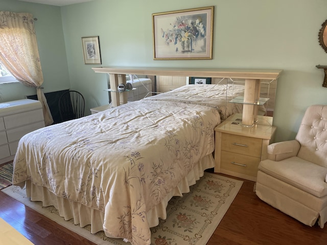 bedroom featuring dark wood-type flooring