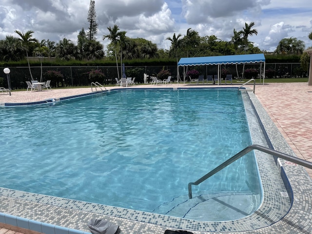 view of swimming pool with a patio area