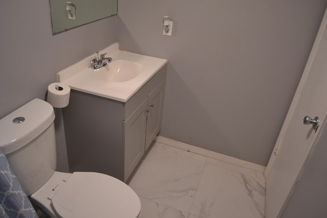 bathroom featuring tile flooring, toilet, and oversized vanity