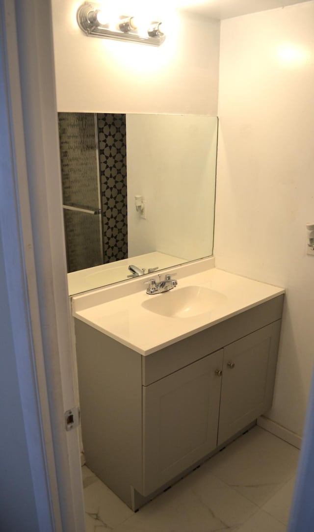 bathroom featuring tile floors and vanity