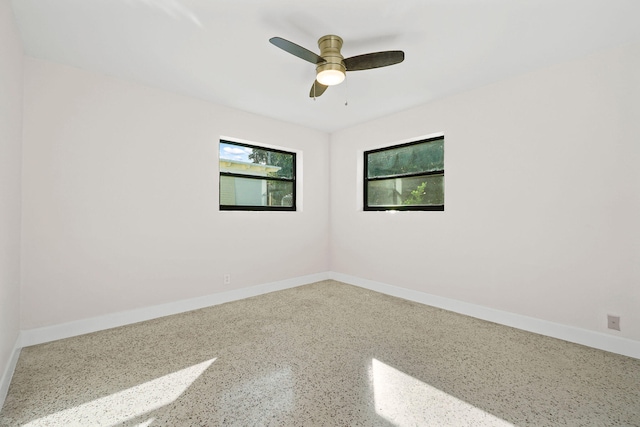 spare room featuring ceiling fan