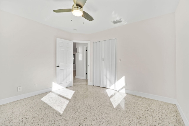 unfurnished bedroom with a closet and ceiling fan