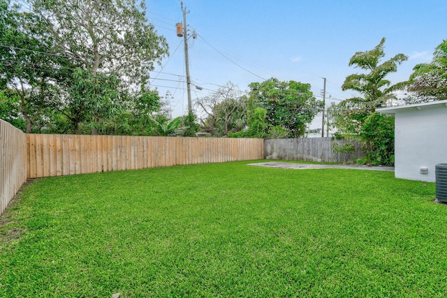 view of yard featuring central AC