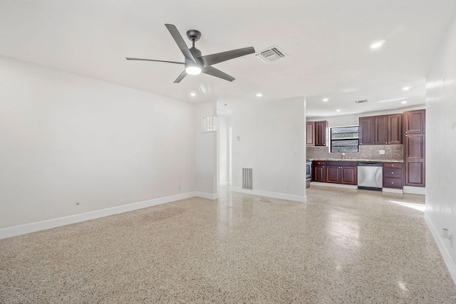 unfurnished living room featuring ceiling fan and sink