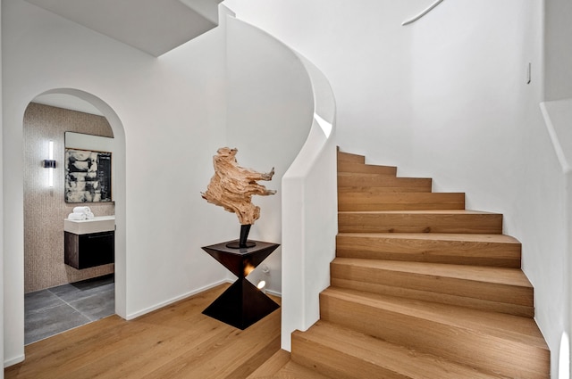 staircase featuring wood-type flooring