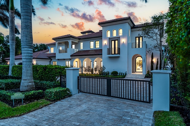 mediterranean / spanish home with a balcony