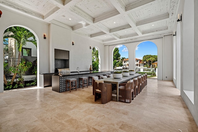 view of patio / terrace with exterior bar and exterior kitchen