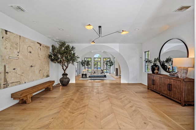 entrance foyer with light parquet flooring