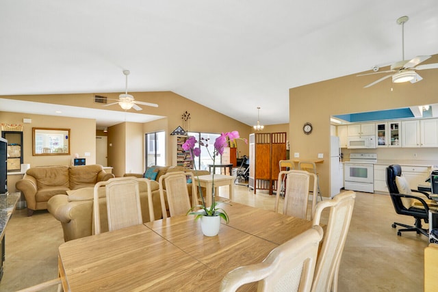 dining area with vaulted ceiling, ceiling fan with notable chandelier, and light tile floors