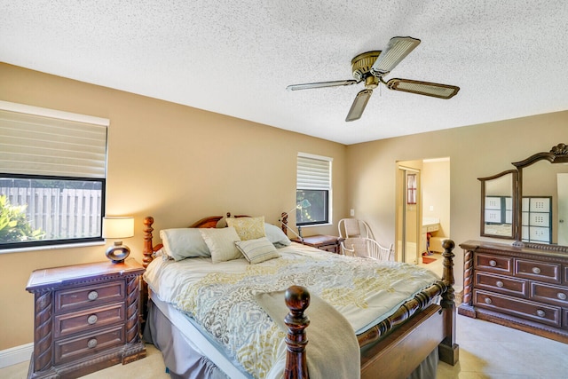 tiled bedroom with ceiling fan and a textured ceiling