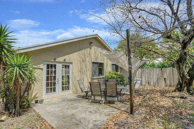 rear view of property with french doors and a patio