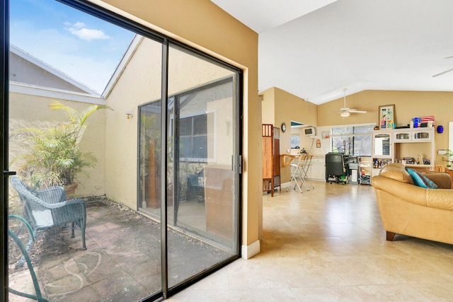 interior space featuring lofted ceiling with skylight and ceiling fan