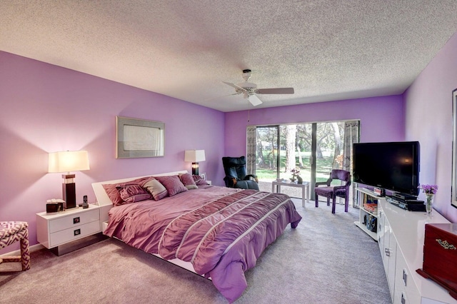 bedroom with access to outside, a textured ceiling, light colored carpet, and ceiling fan