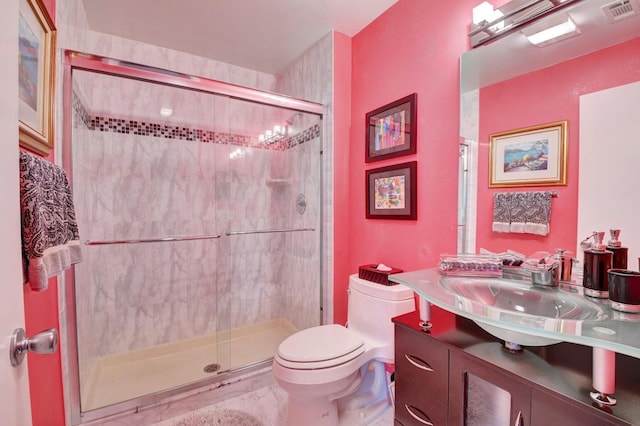 bathroom with vanity, toilet, and walk in shower