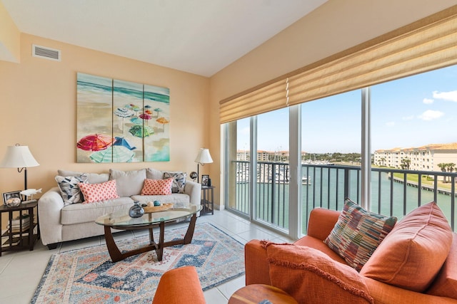 tiled living room with a water view