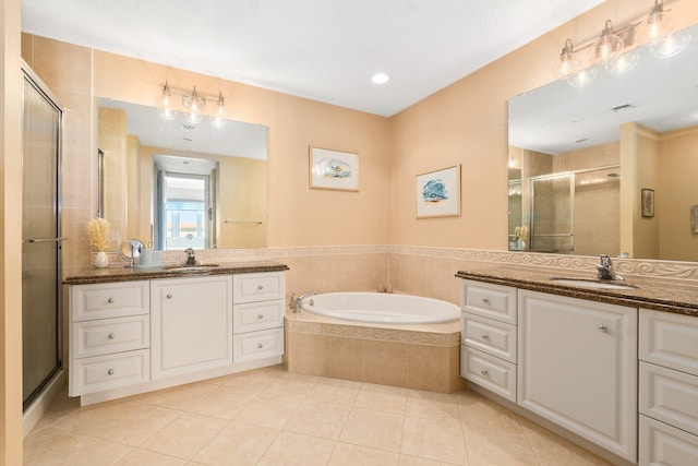 bathroom featuring separate shower and tub, tile floors, and vanity