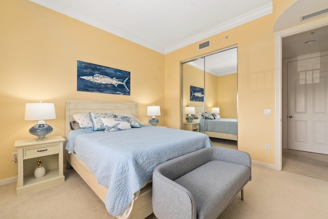 bedroom featuring light colored carpet, a closet, and crown molding