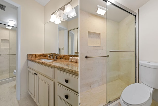 bathroom featuring a shower with door, tile flooring, toilet, and vanity