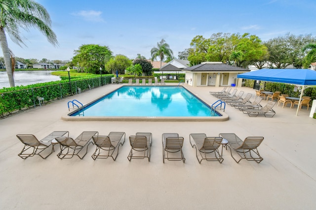 view of swimming pool with a patio area