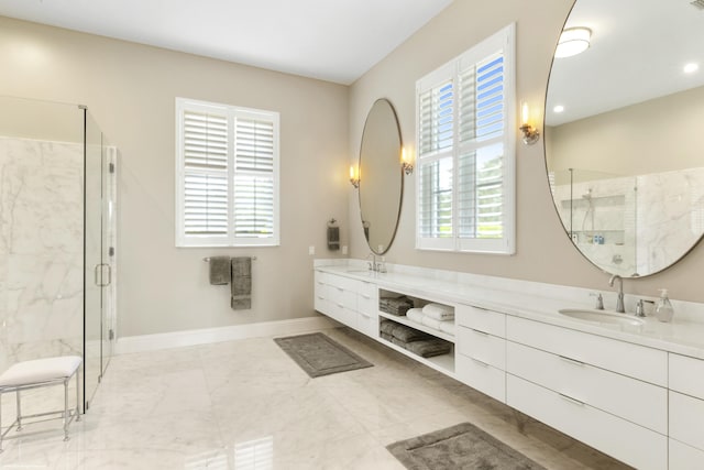 bathroom with walk in shower, vanity, and plenty of natural light