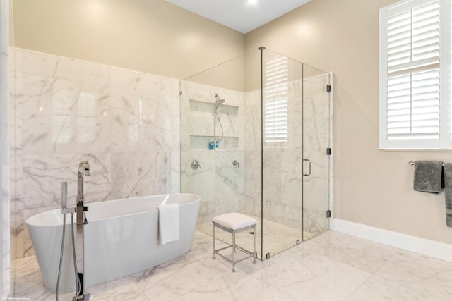 bathroom featuring separate shower and tub