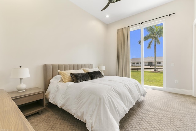 carpeted bedroom with ceiling fan, access to outside, and multiple windows