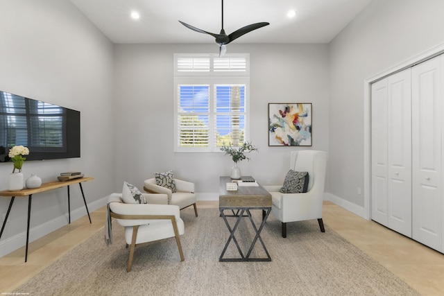 living area featuring ceiling fan