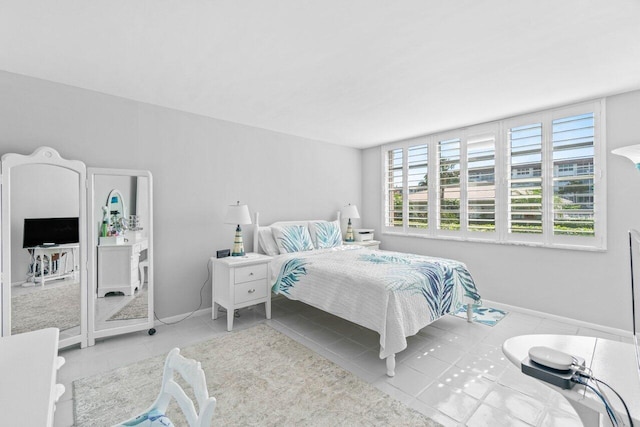 bedroom featuring light tile patterned flooring