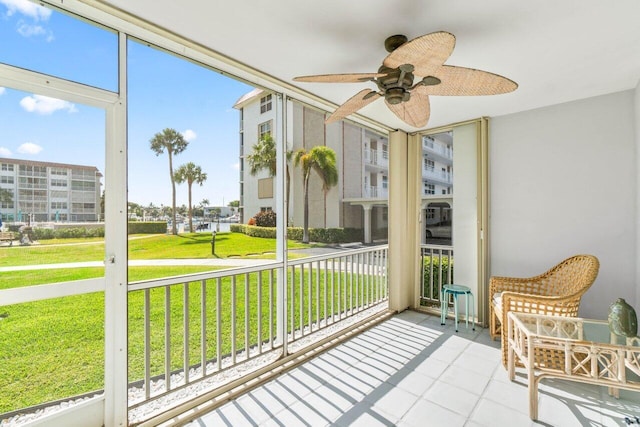 sunroom / solarium with ceiling fan