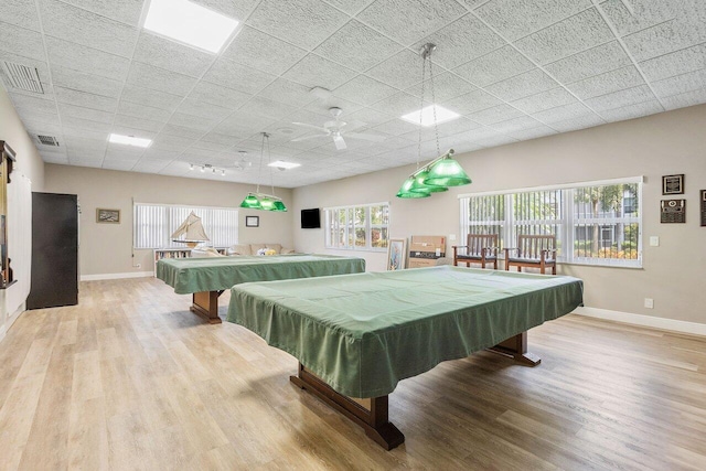 recreation room featuring a paneled ceiling, light hardwood / wood-style floors, pool table, and ceiling fan