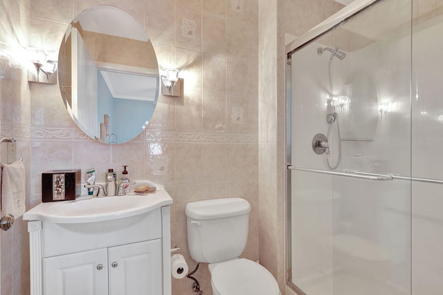 bathroom with tile walls, oversized vanity, walk in shower, toilet, and tasteful backsplash