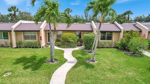 ranch-style house with a front yard