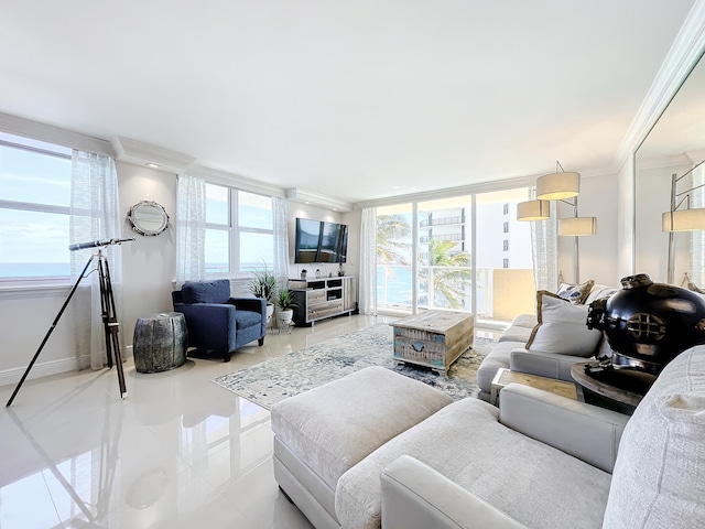 tiled living room featuring ornamental molding, floor to ceiling windows, and a wealth of natural light