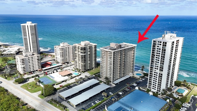 birds eye view of property featuring a water view