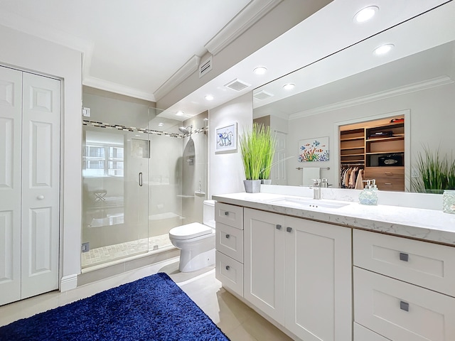 bathroom featuring a shower with shower door, crown molding, toilet, tile flooring, and vanity