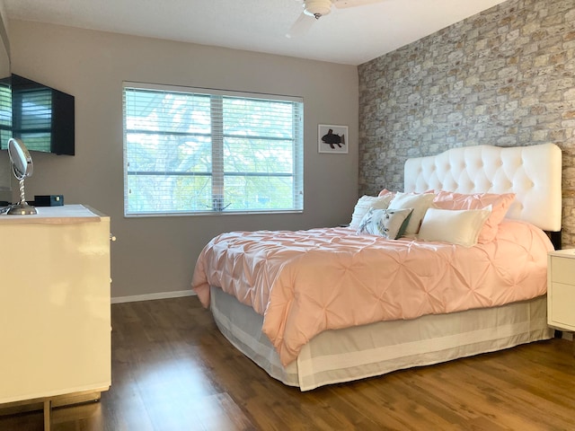 bedroom featuring dark wood-type flooring and ceiling fan