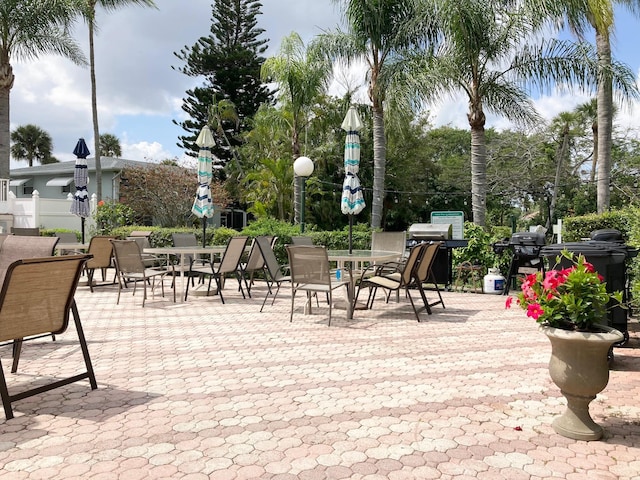 view of terrace with a grill