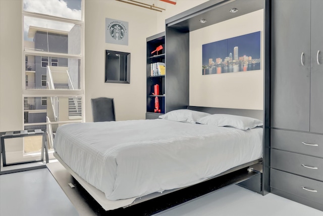 bedroom with concrete flooring