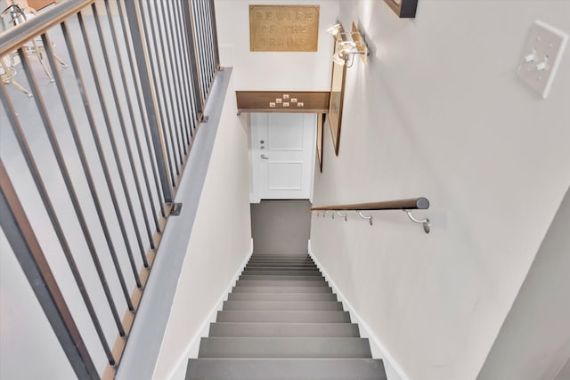 stairs with hardwood / wood-style flooring