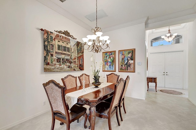 dining room with ornamental molding, a chandelier, and light tile floors