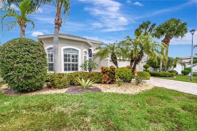 view of property exterior with a lawn