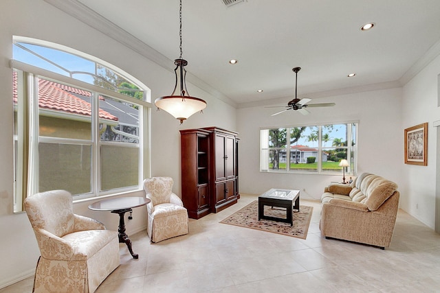 tiled living room featuring ornamental molding and ceiling fan