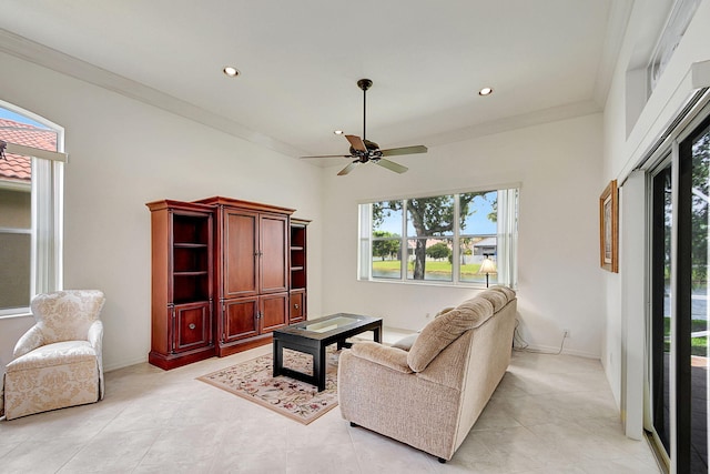 tiled living room featuring ceiling fan and crown molding