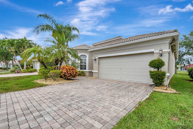 exterior space featuring a front yard and a garage