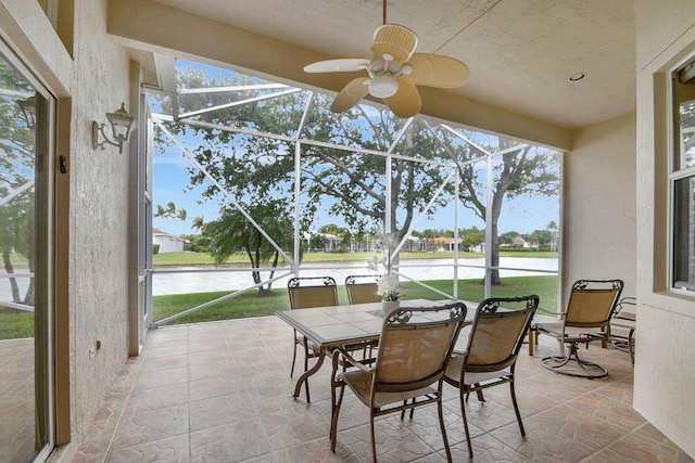 sunroom / solarium with ceiling fan